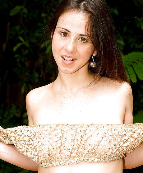 Foxy american teen Helena Lopez revealing small tits and sexy ass outdoor