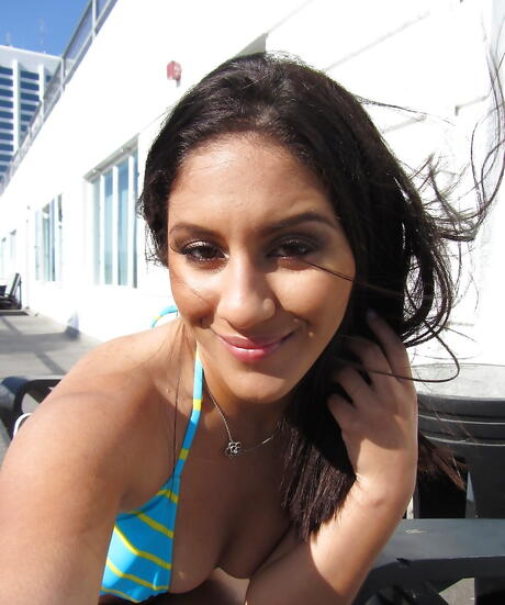 Slim american hottie Liv Aguilera exhibits small tits and spreads her legs outside